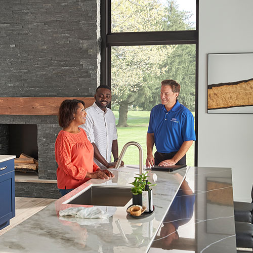 hvac-dealer-talking-to-homeowners-in-kitchen-Air-Conditioning-&-Heating-Service-Company-Santa-Fe-New-Mexico